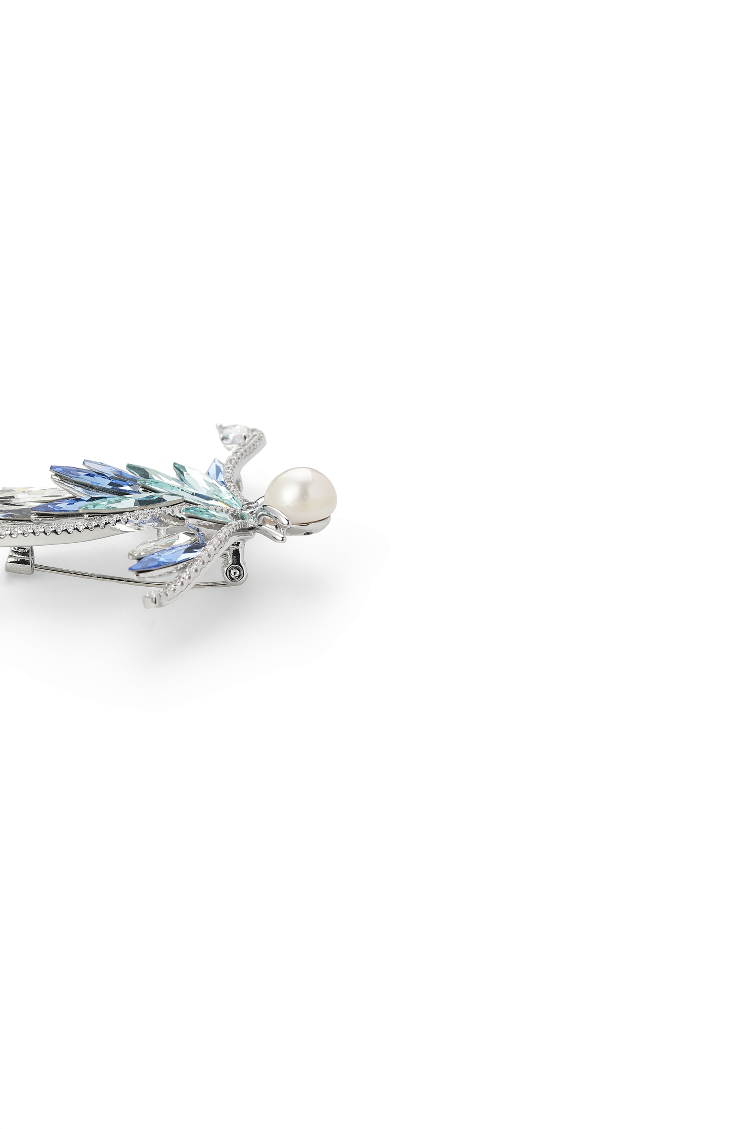 Side view of the Aiko Tanaka Ao no Senko pearl brooch showing its blue crystal leaves and silver setting, on white