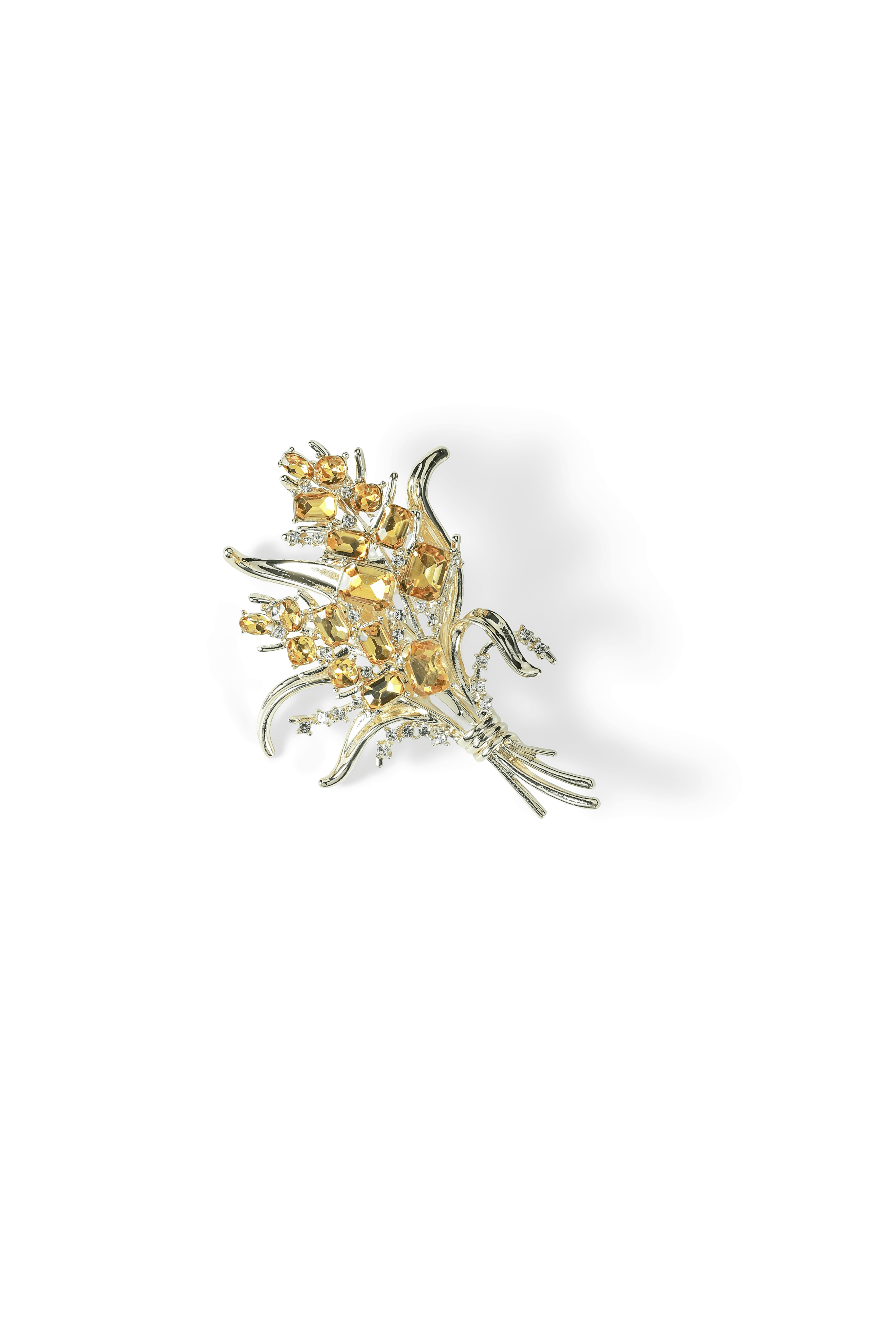 Aiko Tanaka Kogane no Minori brooch, a gold wheat-like spray of yellow crystals on fine stems, on a white background