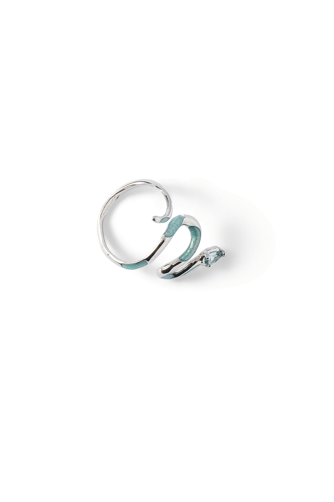 Aiko Tanaka Hebi no Nami ring, a silver serpent coiled into an open wave band with blue-green enamel, on white