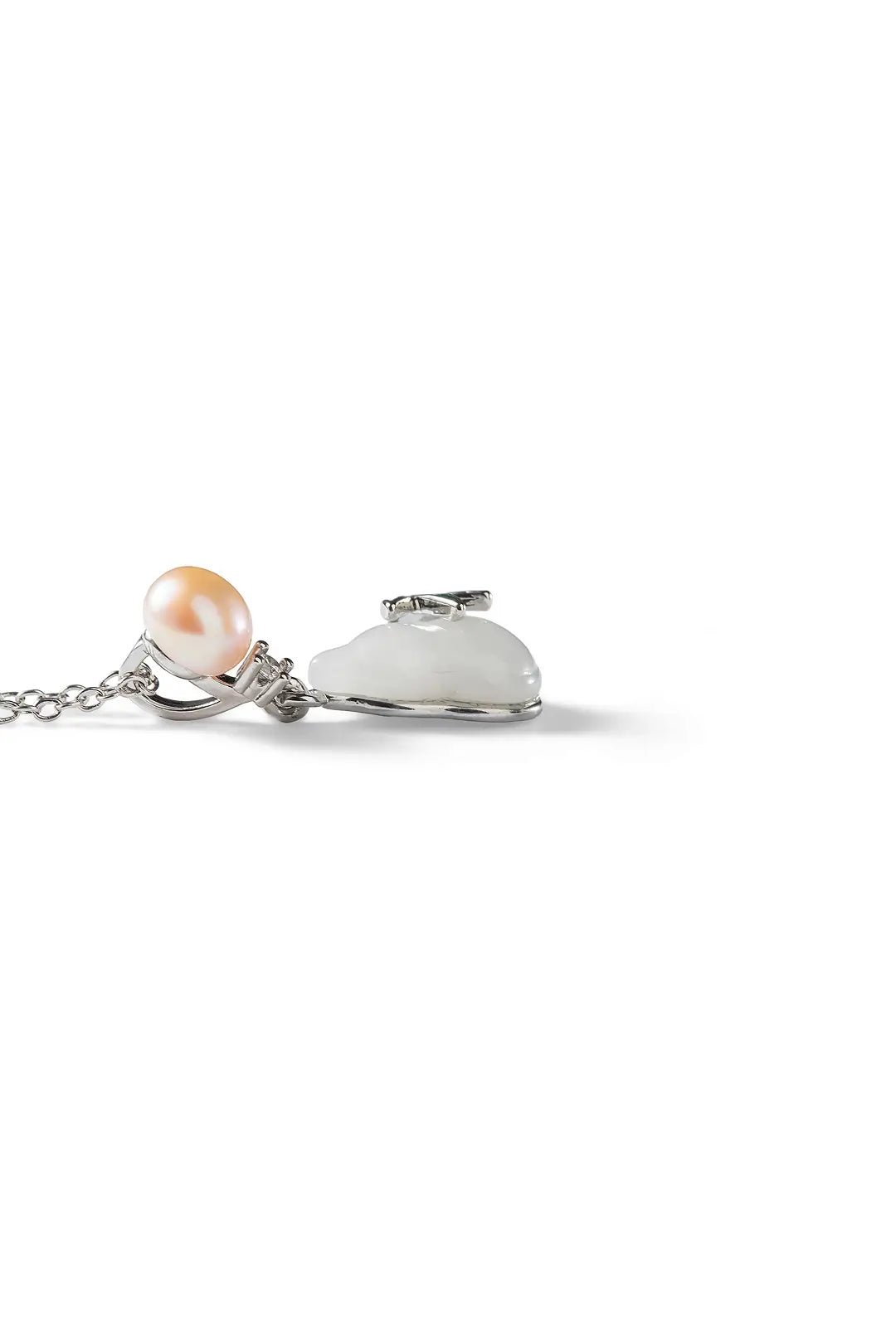 Aiko Tanaka Tsuyu no Kakera necklace lying flat, a peach pearl and white enamel gourd pendant on a white background