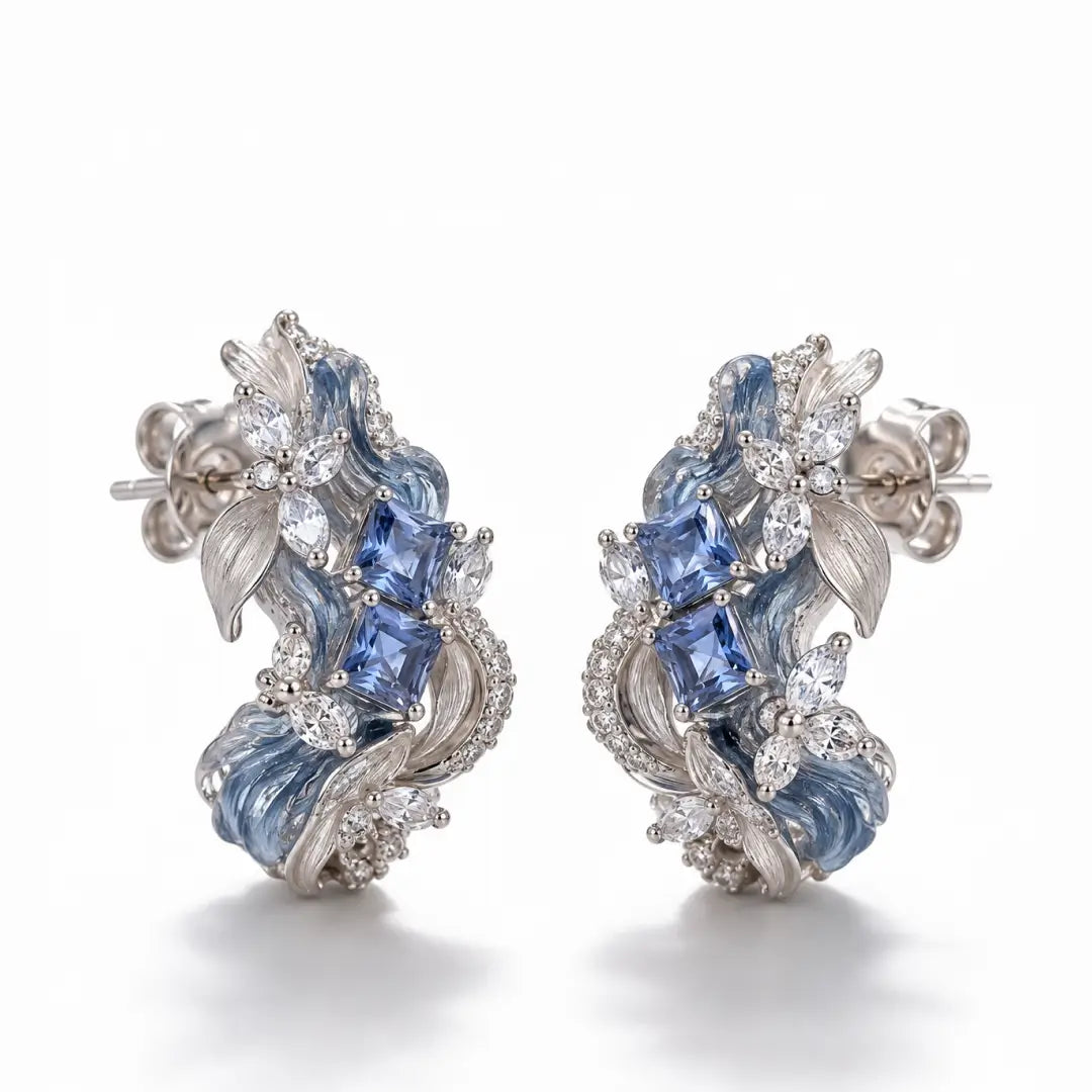Aiko Tanaka High Jewelry No. 003 earrings, a pair of blue stone and silver wave hoops, shown on a white background