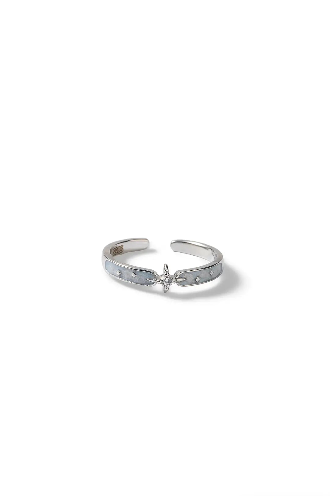 Aiko Tanaka Hoshikage ring, a thin open silver band with a small star and crystal accent, on white