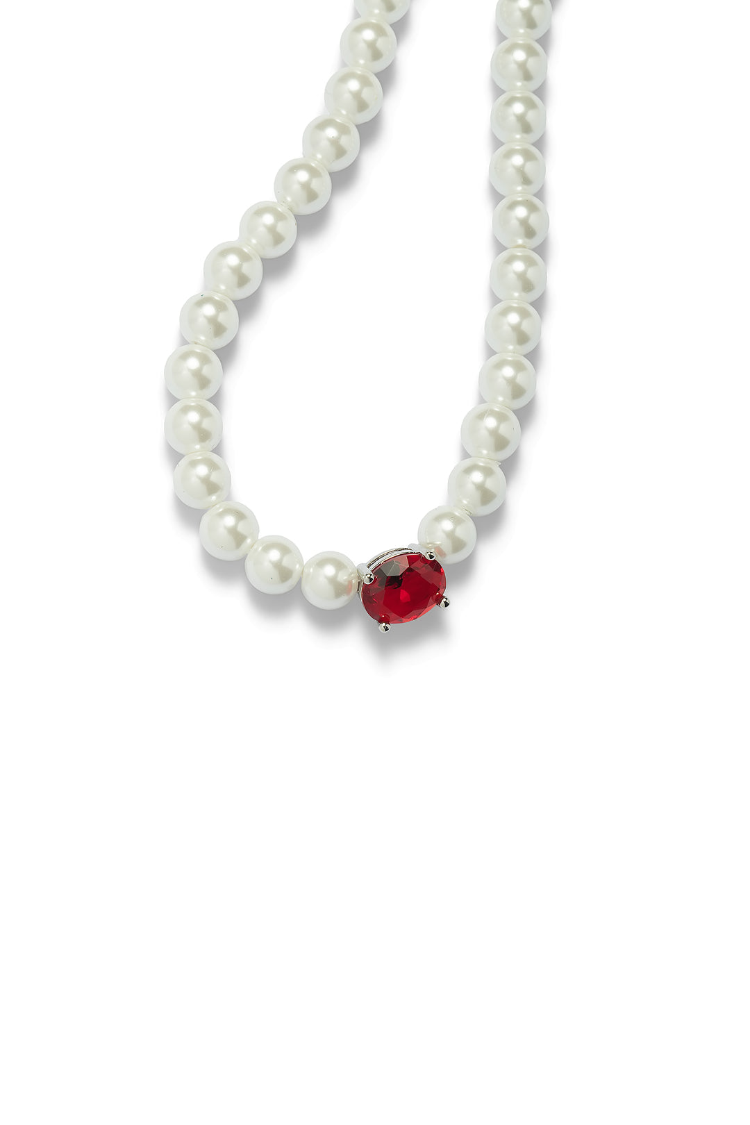 Close-up of the Aiko Tanaka Aka no Kyokai pearl strand necklace showing its faceted red stone centerpiece, on white