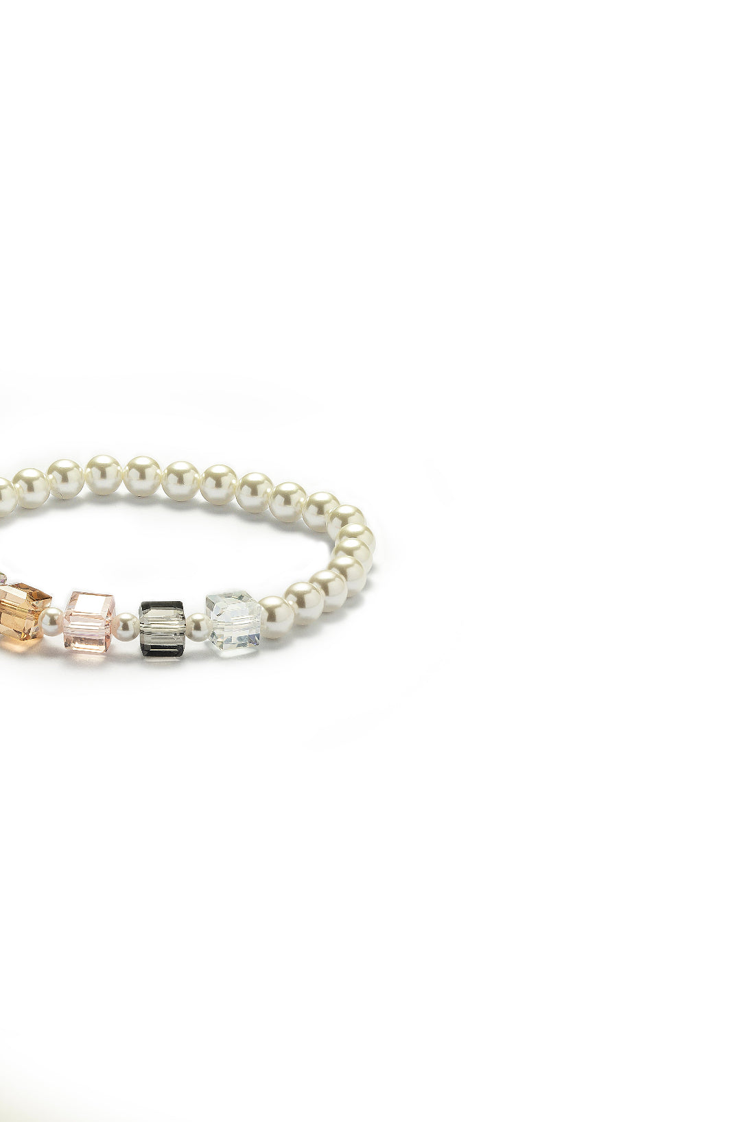 Aiko Tanaka Kosai no Wa white pearl bracelet with amber, pink and grey crystal cube accents, angled view on white