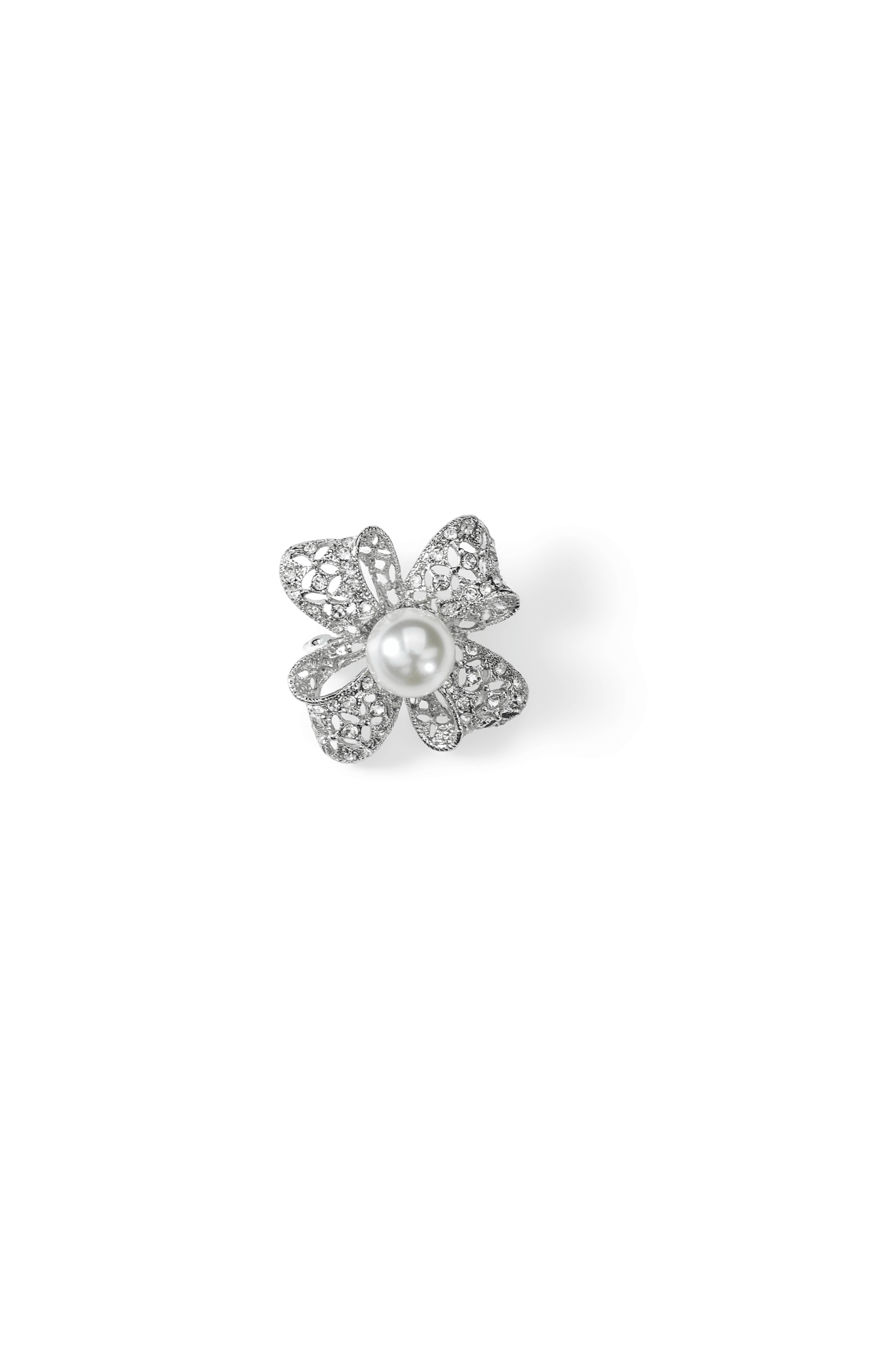 Aiko Tanaka Hikari no Hana brooch, a silver four-petal flower of pave crystals with a white pearl center, on white