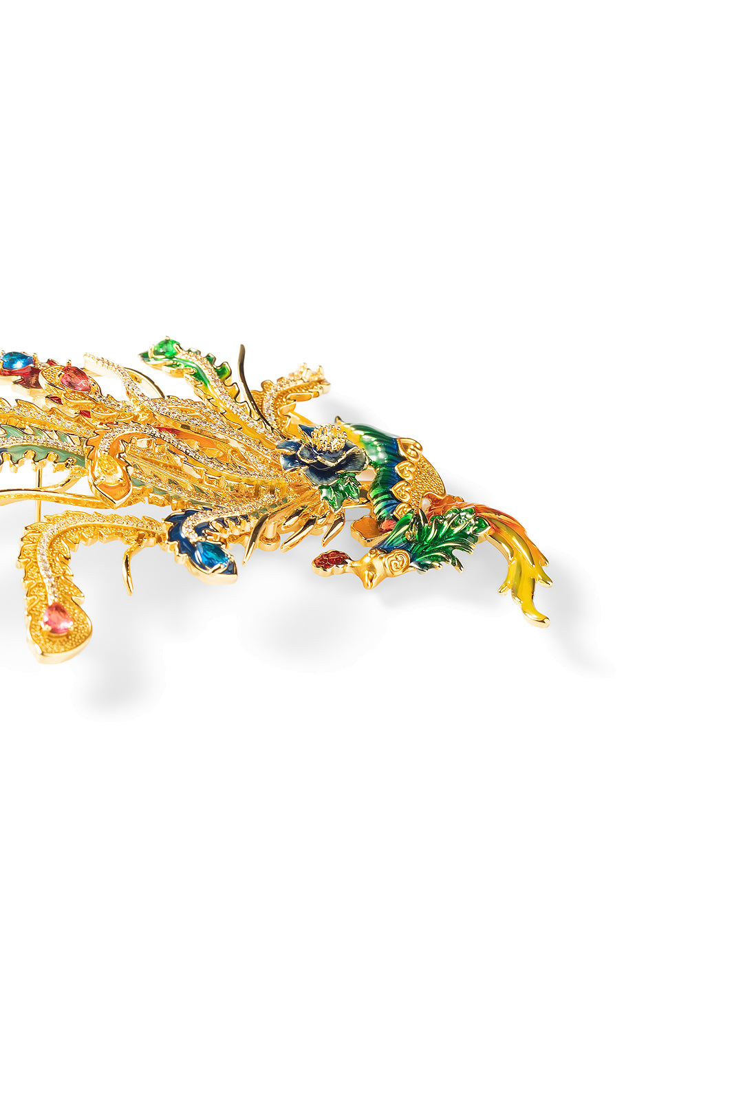 Side view of the Aiko Tanaka Hoo no Kinka gold phoenix brooch with sparkling crystals and enamel plumes, on white