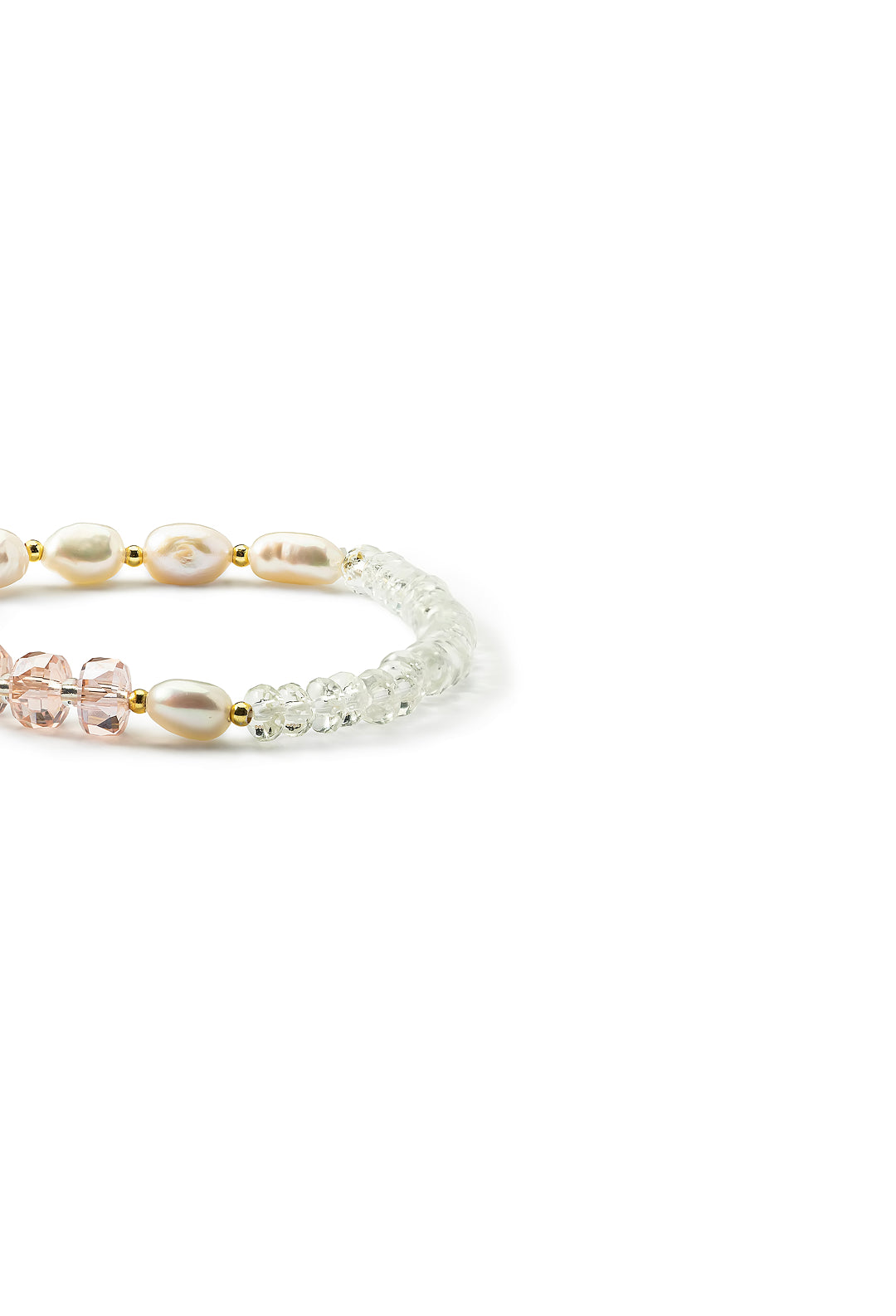 Side view of the pink Aiko Tanaka Hoshi no Kakera bracelet with white pearls, pink crystals and clear beads, on white