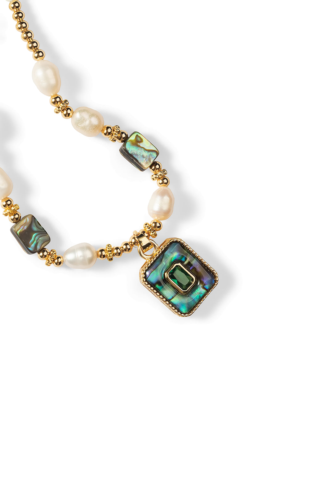 Close-up of the Aiko Tanaka Kai no Hoseki pearl necklace showing abalone shell beads and its framed square pendant