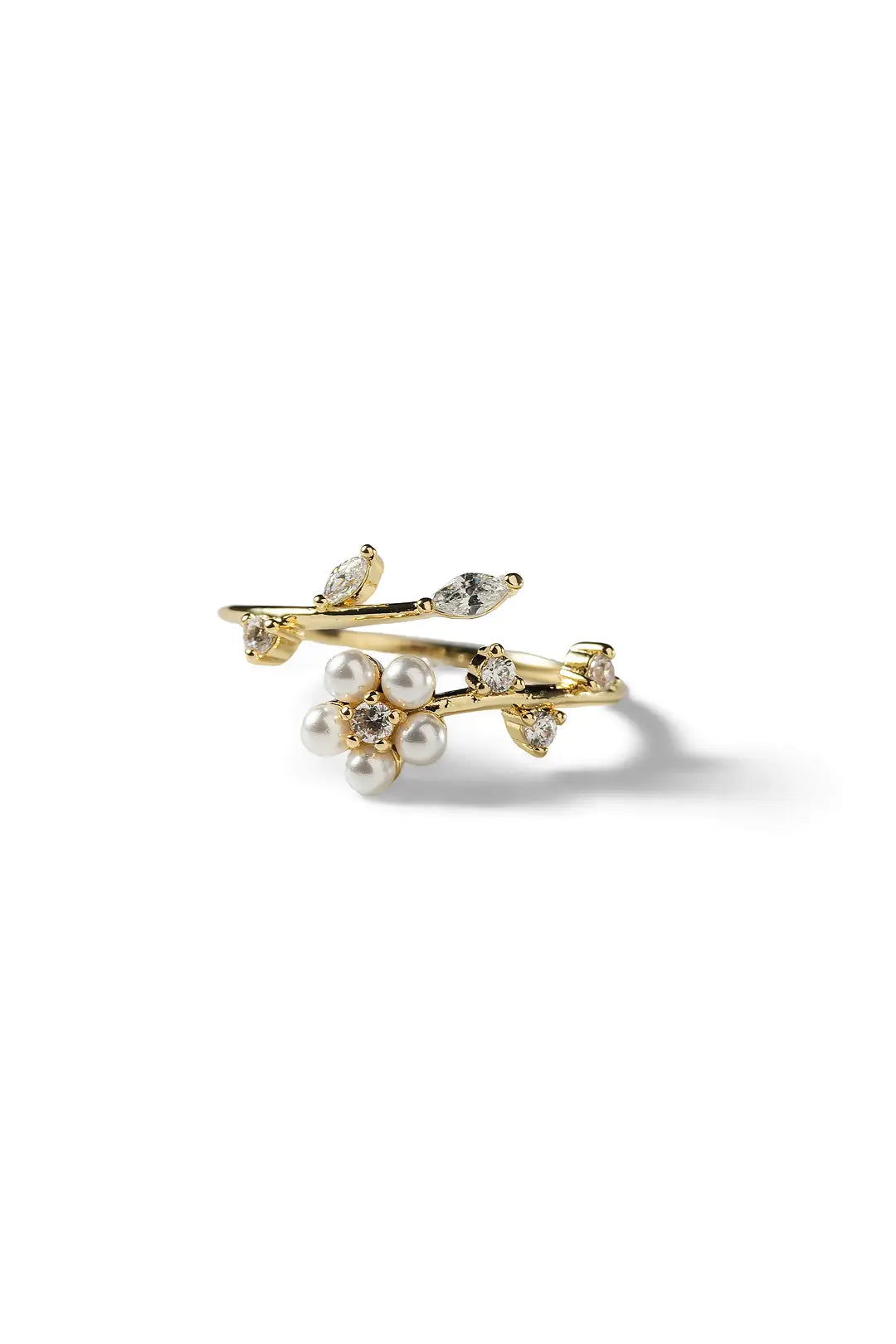 Aiko Tanaka Konoha ring, a gold open band with leaf sprigs and small pearls, shown on a white background