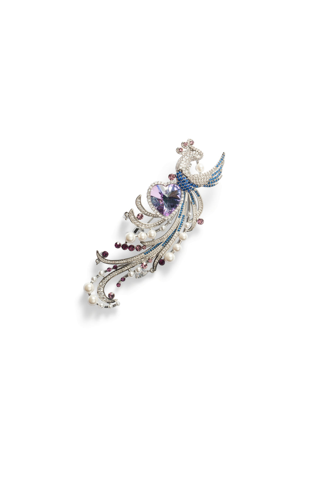 Aiko Tanaka Kujaku no Shingetsu brooch, a silver peacock with a lilac heart stone, blue crystals and pearls, on white
