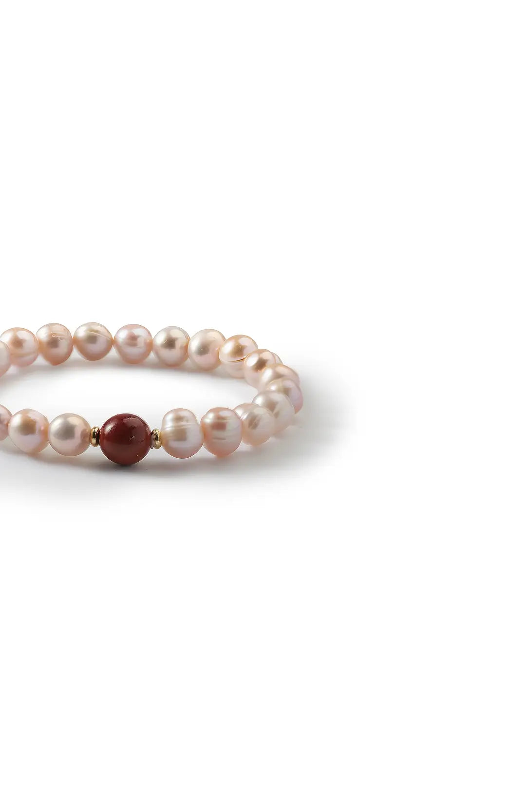 Aiko Tanaka Kurenai bracelet side view, pink freshwater pearls with a single red bead accent, white background