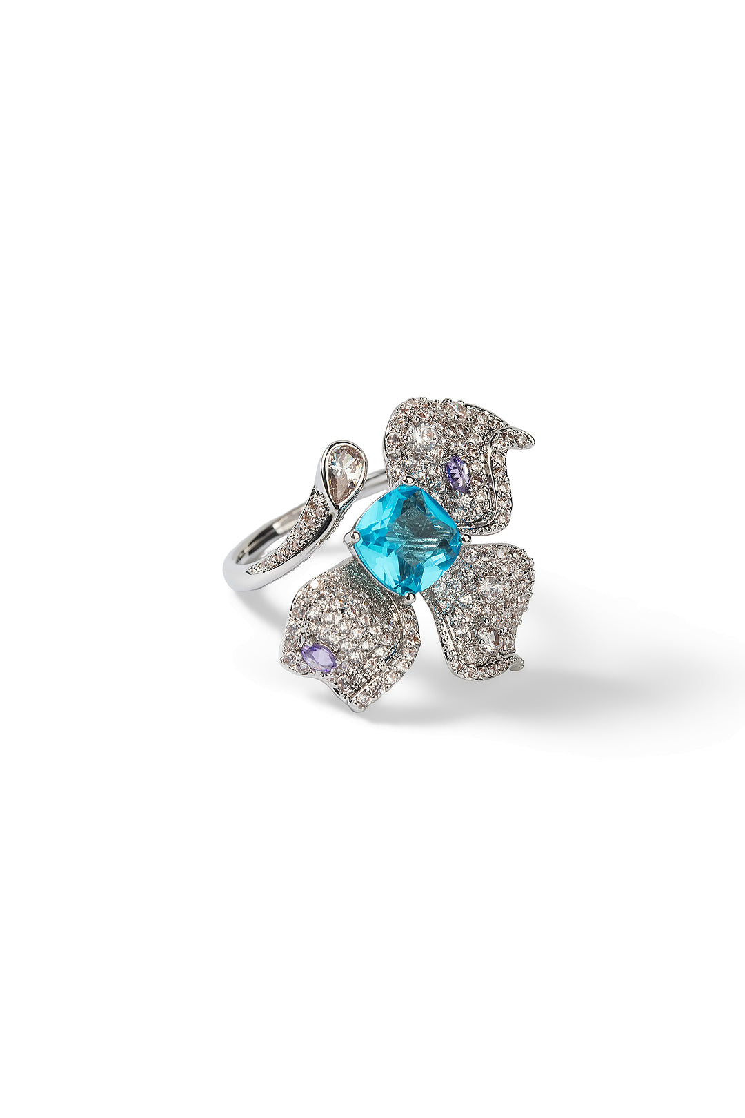 Aiko Tanaka Mizu no Ran ring, a silver orchid of lilac crystals around an aqua blue stone, on a white background