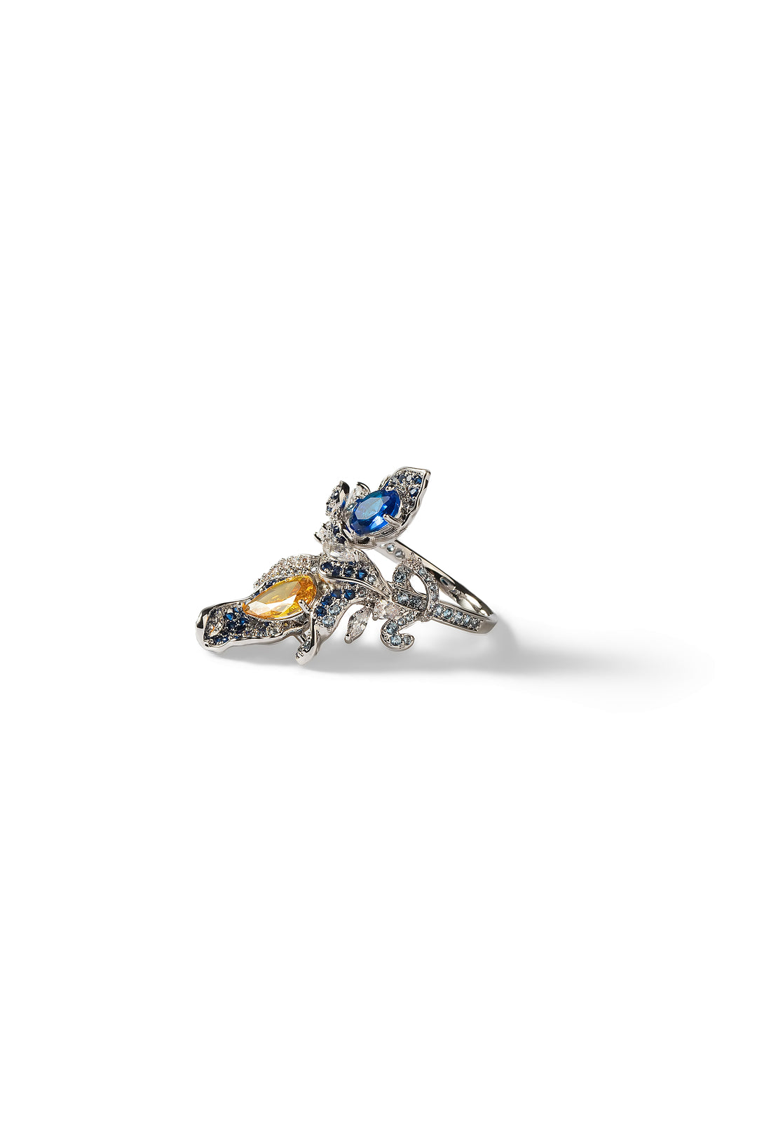 Aiko Tanaka Seiran no Mai ring, a silver flower with blue petals and a yellow stone, small product shot on white