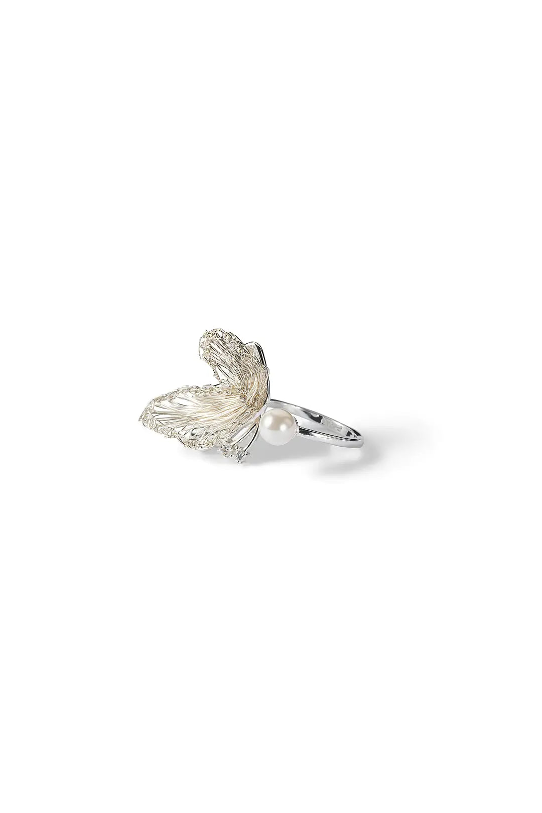 Aiko Tanaka Shiro Tsubasa ring, a small silver wing ring with a pearl, shown from the side on a white background