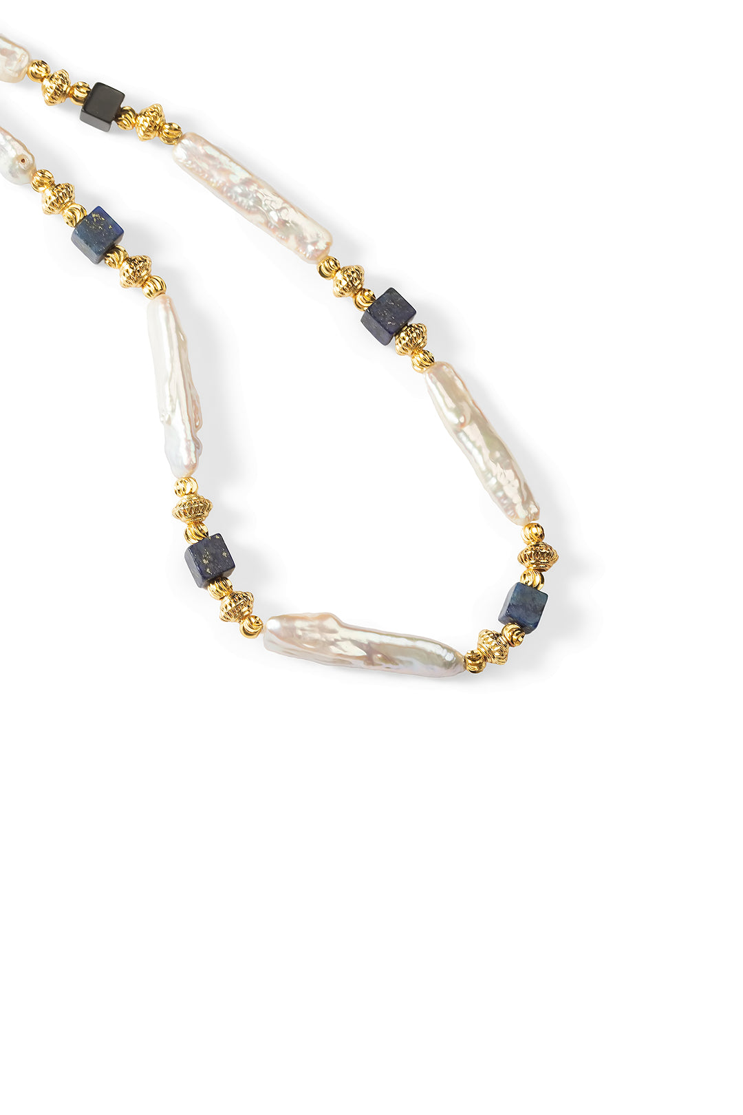 Close-up of the Aiko Tanaka Shizuku no Kage strand of white biwa stick pearls, navy cubes and gold beads, on white