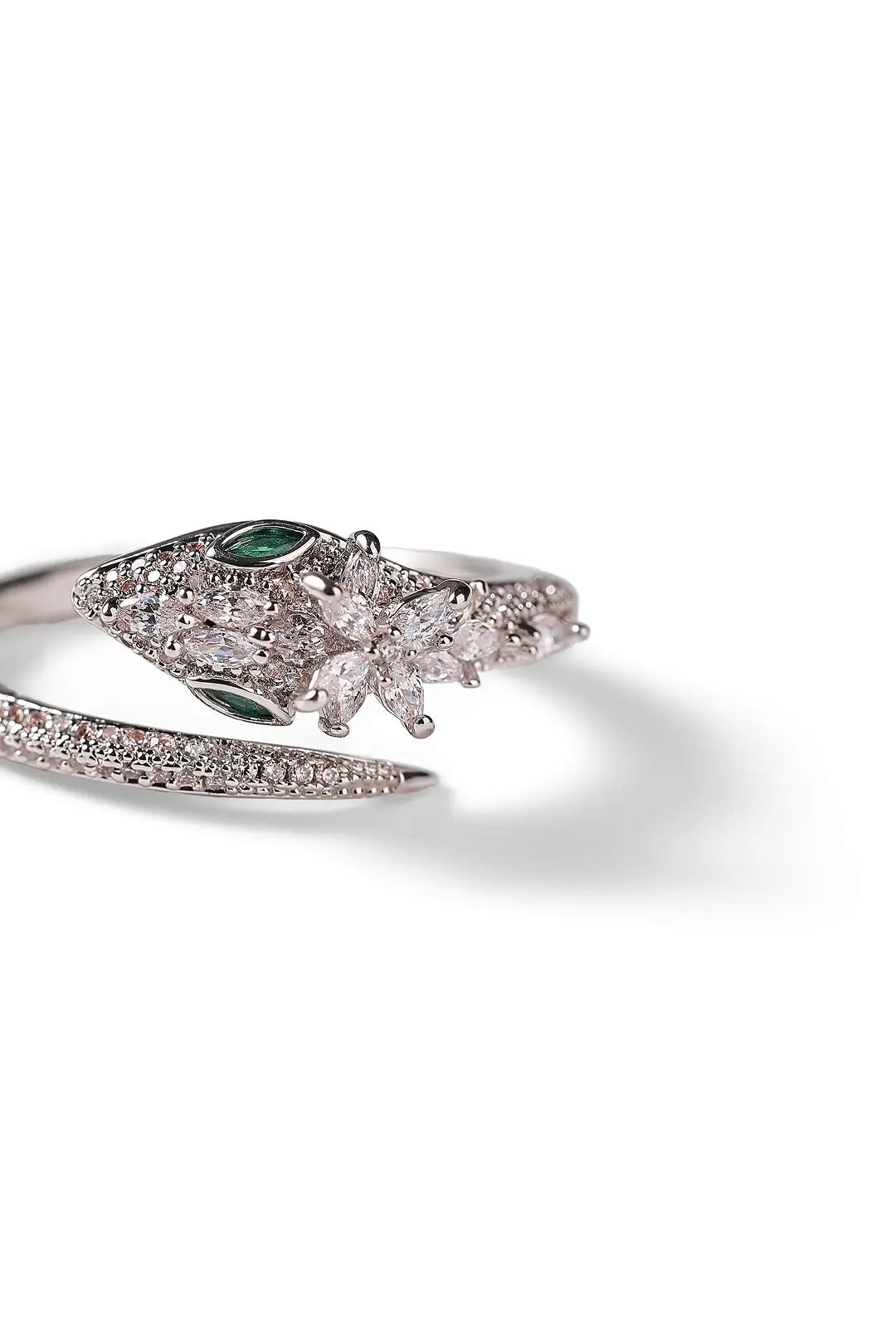 Aiko Tanaka Tokage no Mori ring, a sparkling silver lizard coiled along a crystal band, on a white background