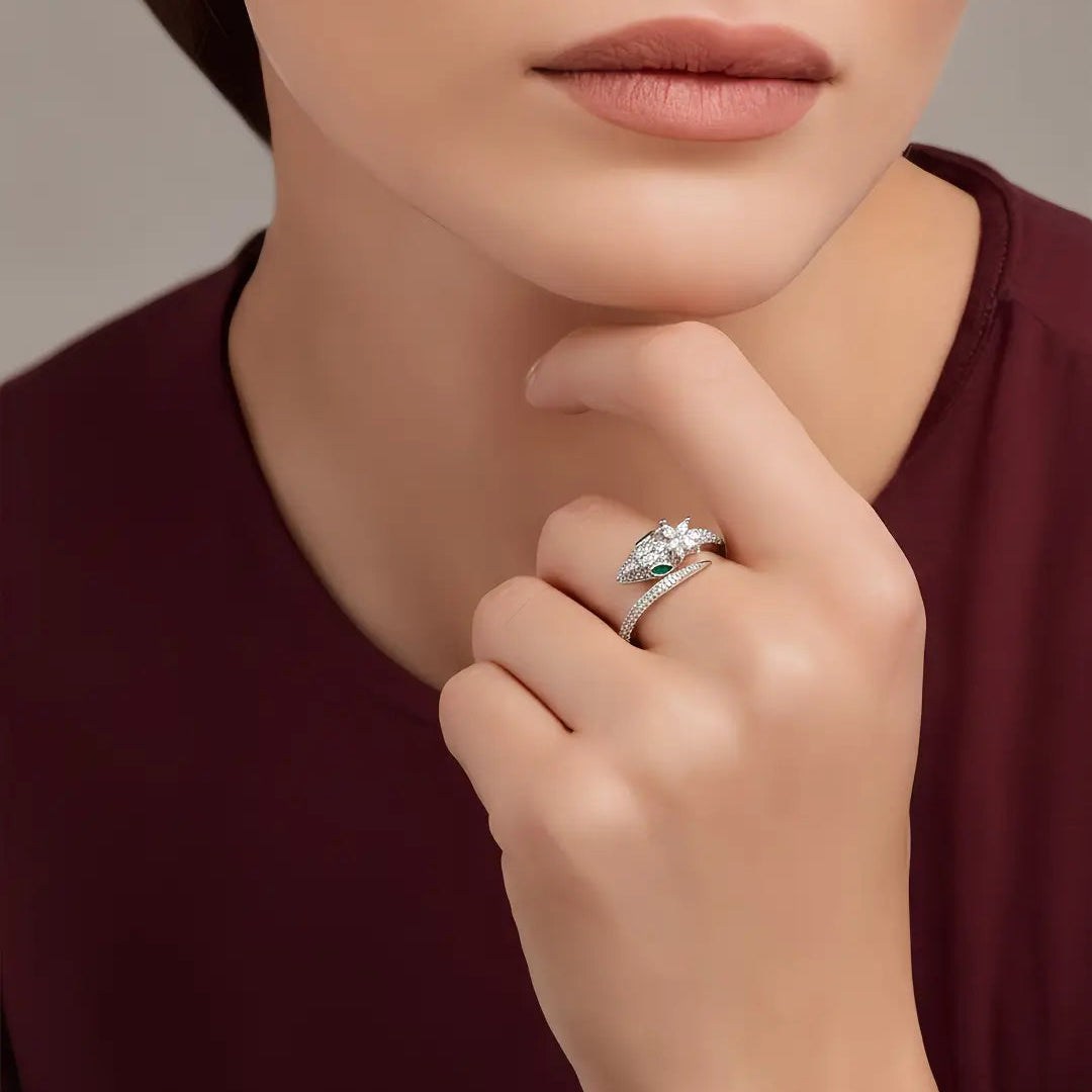Woman in a burgundy top resting her chin on her hand wearing the Aiko Tanaka Tokage no Mori lizard ring