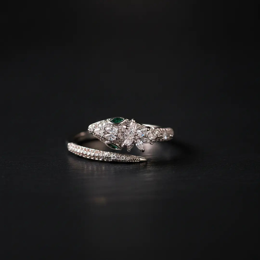 Aiko Tanaka Tokage no Mori ring, a silver lizard with pave crystals wrapped around an open band, on black