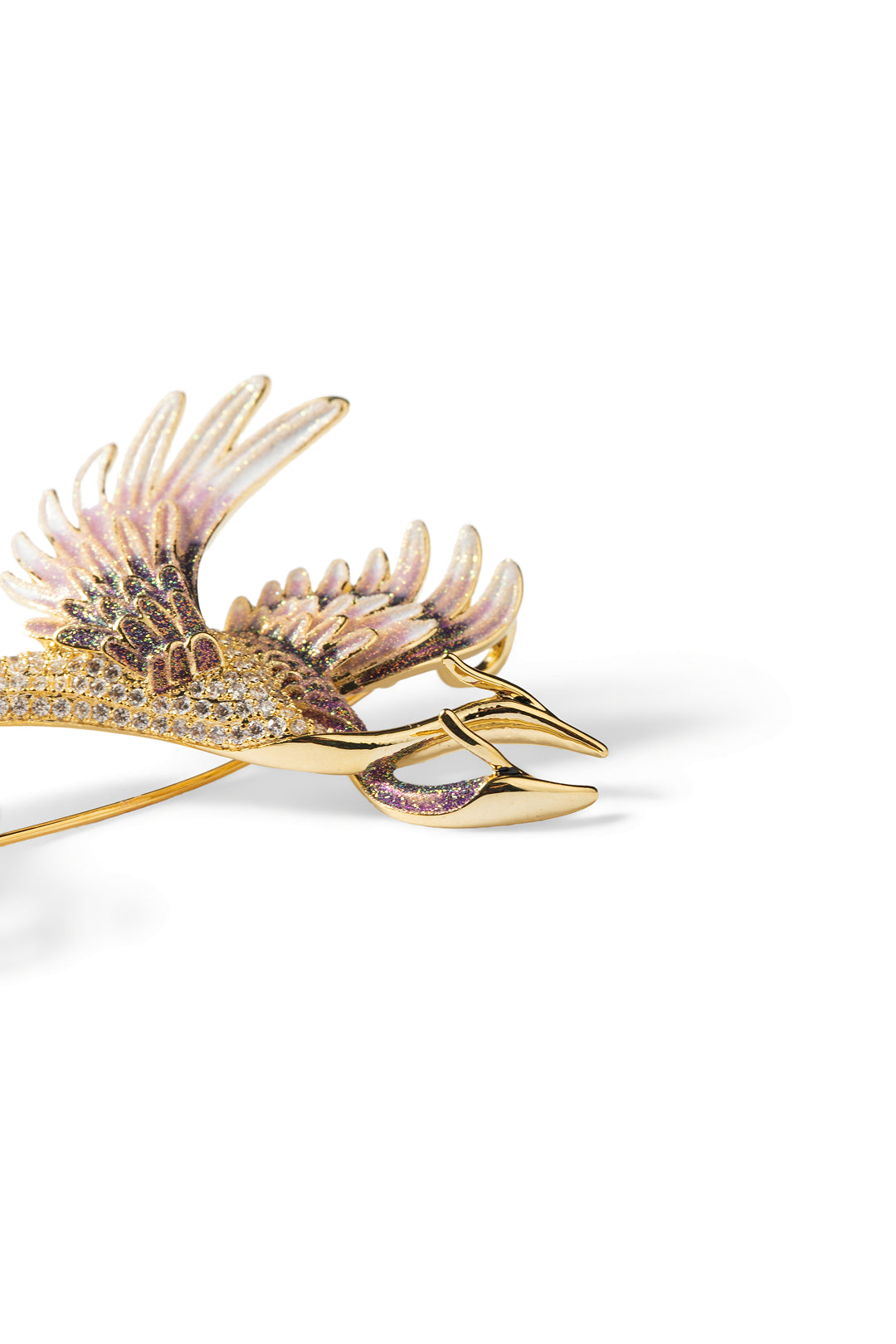 Side view of the Aiko Tanaka Tsuru no Korin gold crane brooch with pink enamel feathers and a long beak, on white
