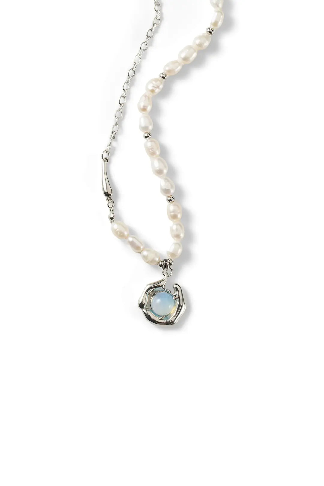 Aiko Tanaka Ukifune necklace laid out, a freshwater pearl strand ending in a silver-framed blue moonstone pendant