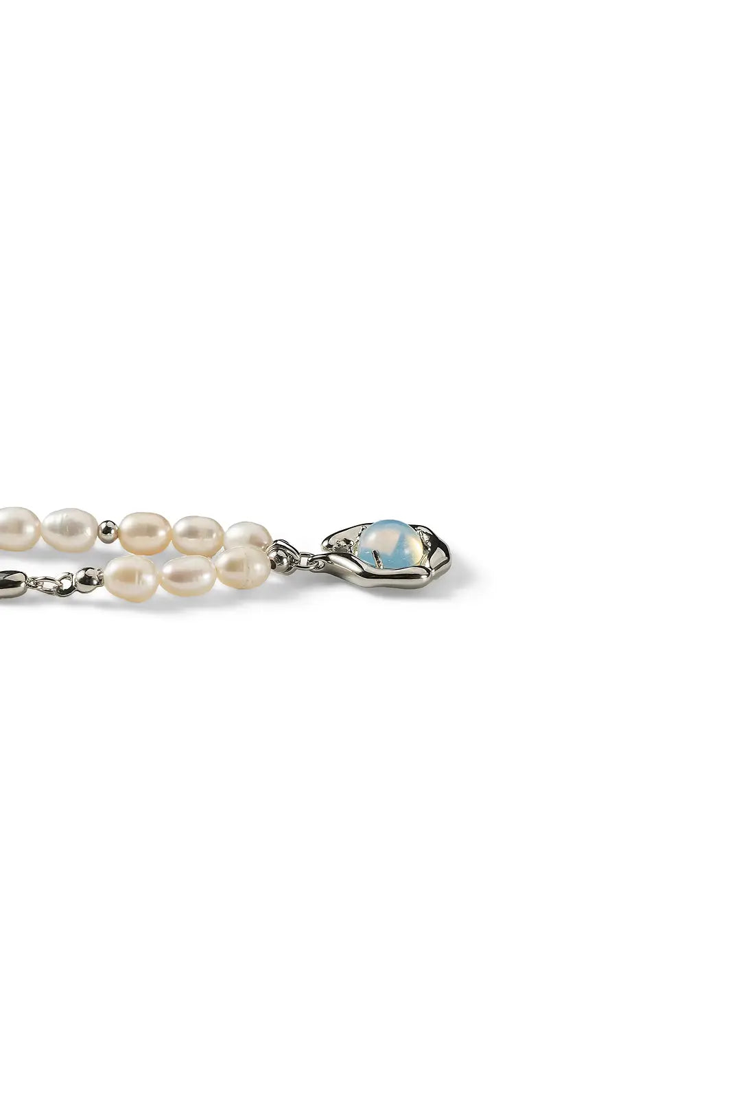 Aiko Tanaka Ukifune necklace, a freshwater pearl strand with a blue moonstone halo pendant, on a white background