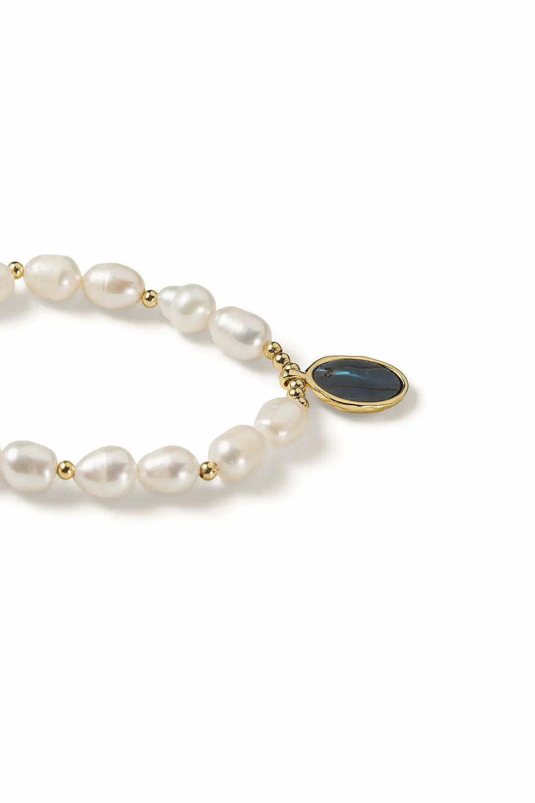 Aiko Tanaka Utsuro necklace close-up, freshwater pearls leading to a teal oval stone pendant, on a white background