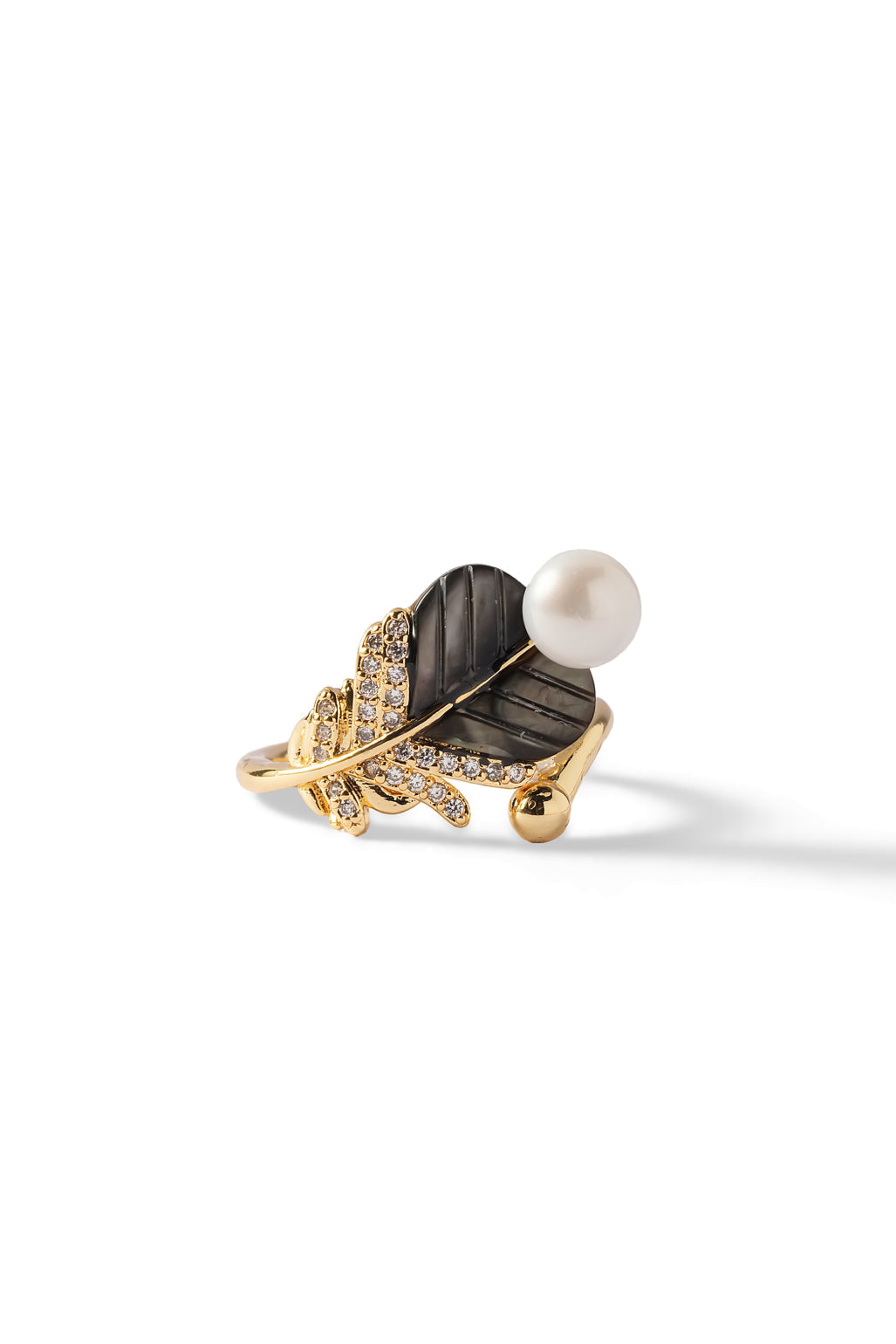 Aiko Tanaka Yoru no Ha ring, a dark smoky leaf with gold pave veins and a white pearl on a gold band, on white