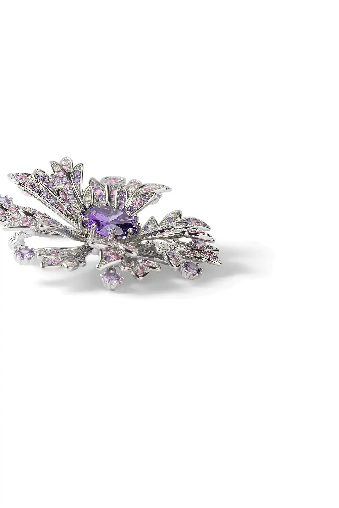 Aiko Tanaka Yozakura brooch side view, layered lilac crystal petals around a violet stone, on a white background